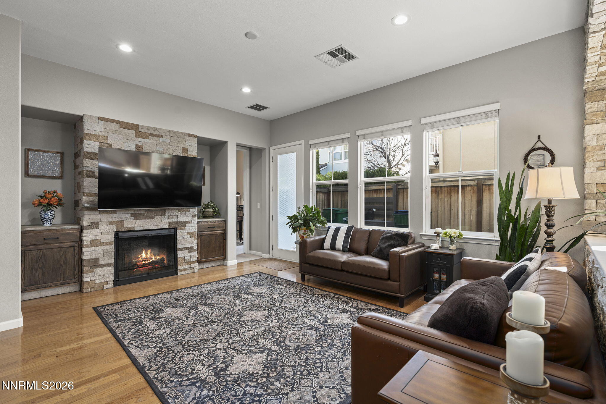 2220 Heavenly View Trail Reno, NV 89523 - Photo 4 of 29 a living room with furniture a flat screen tv and a fireplace