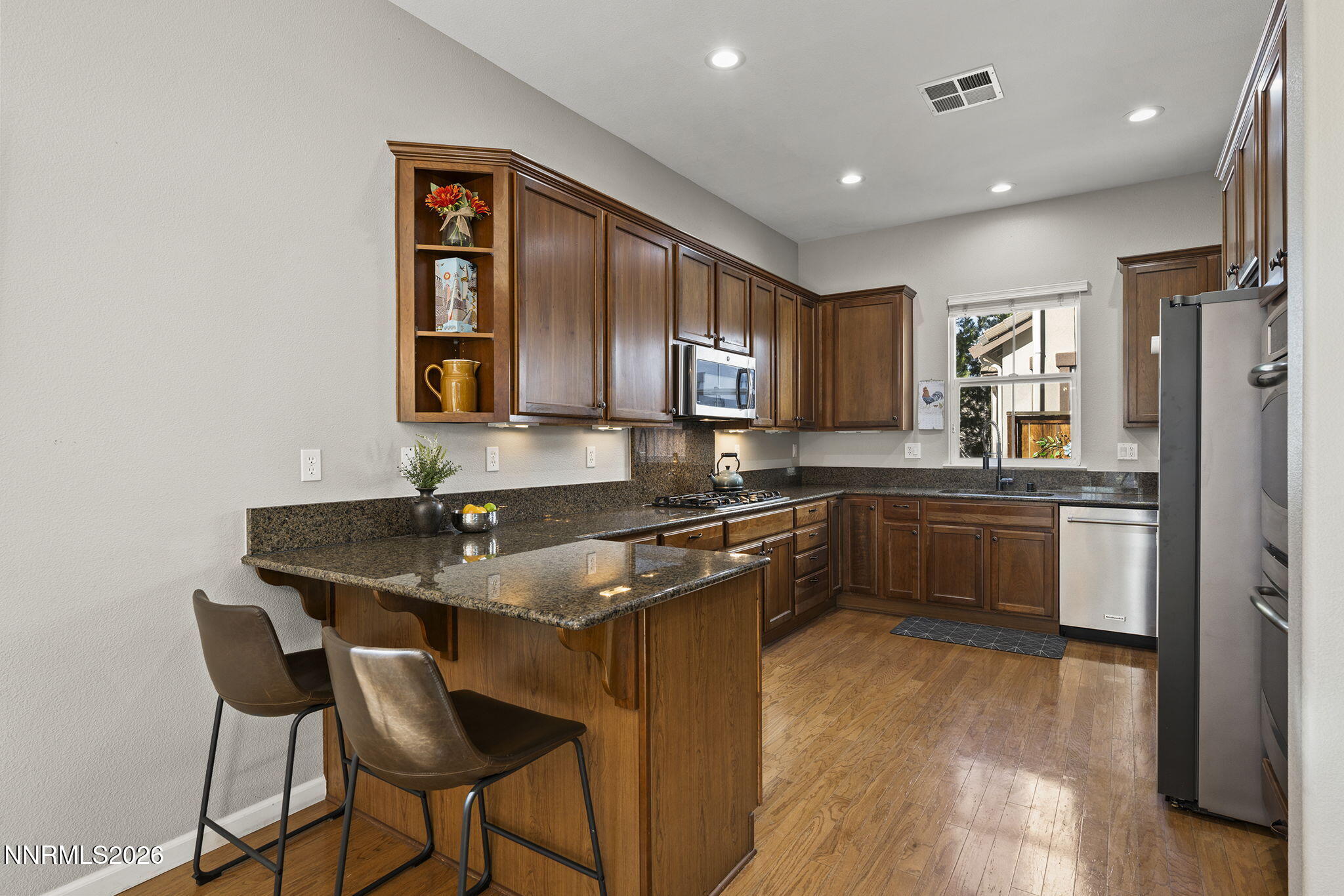 2220 Heavenly View Trail Reno, NV 89523 - Photo 9 of 29 a kitchen with stainless steel appliances granite countertop a sink stove and refrigerator