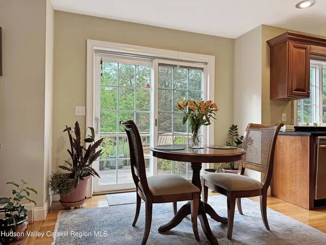 a view of a dining room with furniture and window