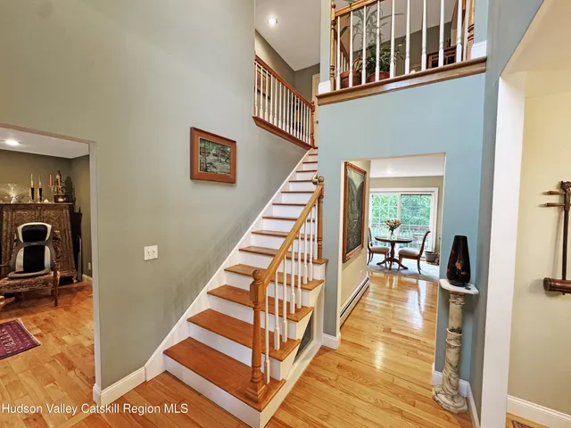 a view of entryway and hall with dining room