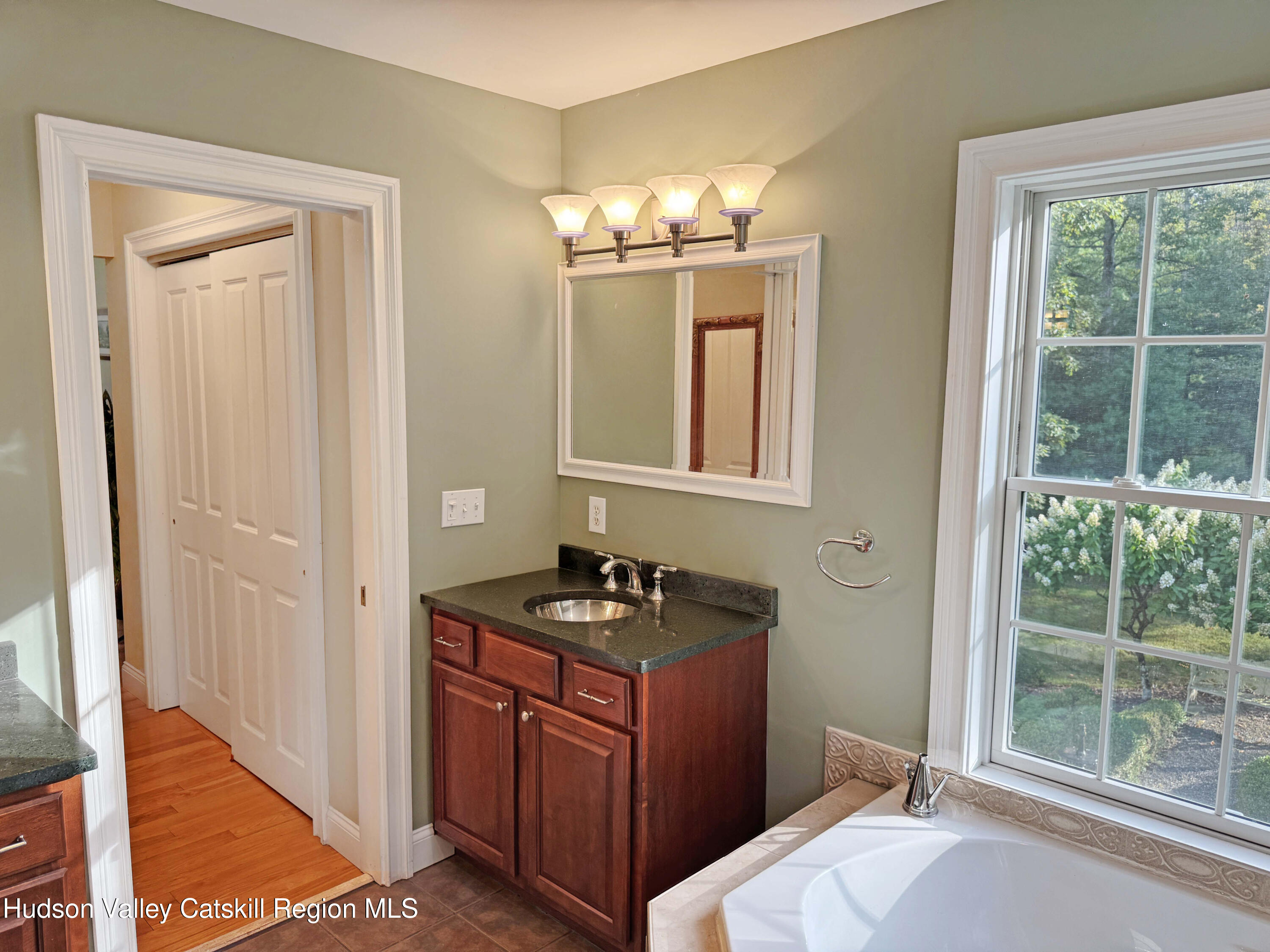 189 Bush Road Stone Ridge, NY 12484 - Photo 21 of 35 a kitchen with a sink and a window