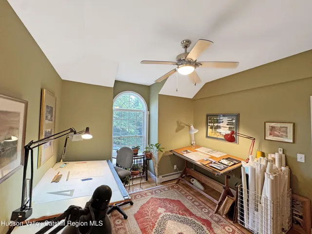 a bedroom with furniture and a window