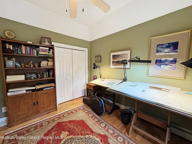 a living room with furniture a rug and a window
