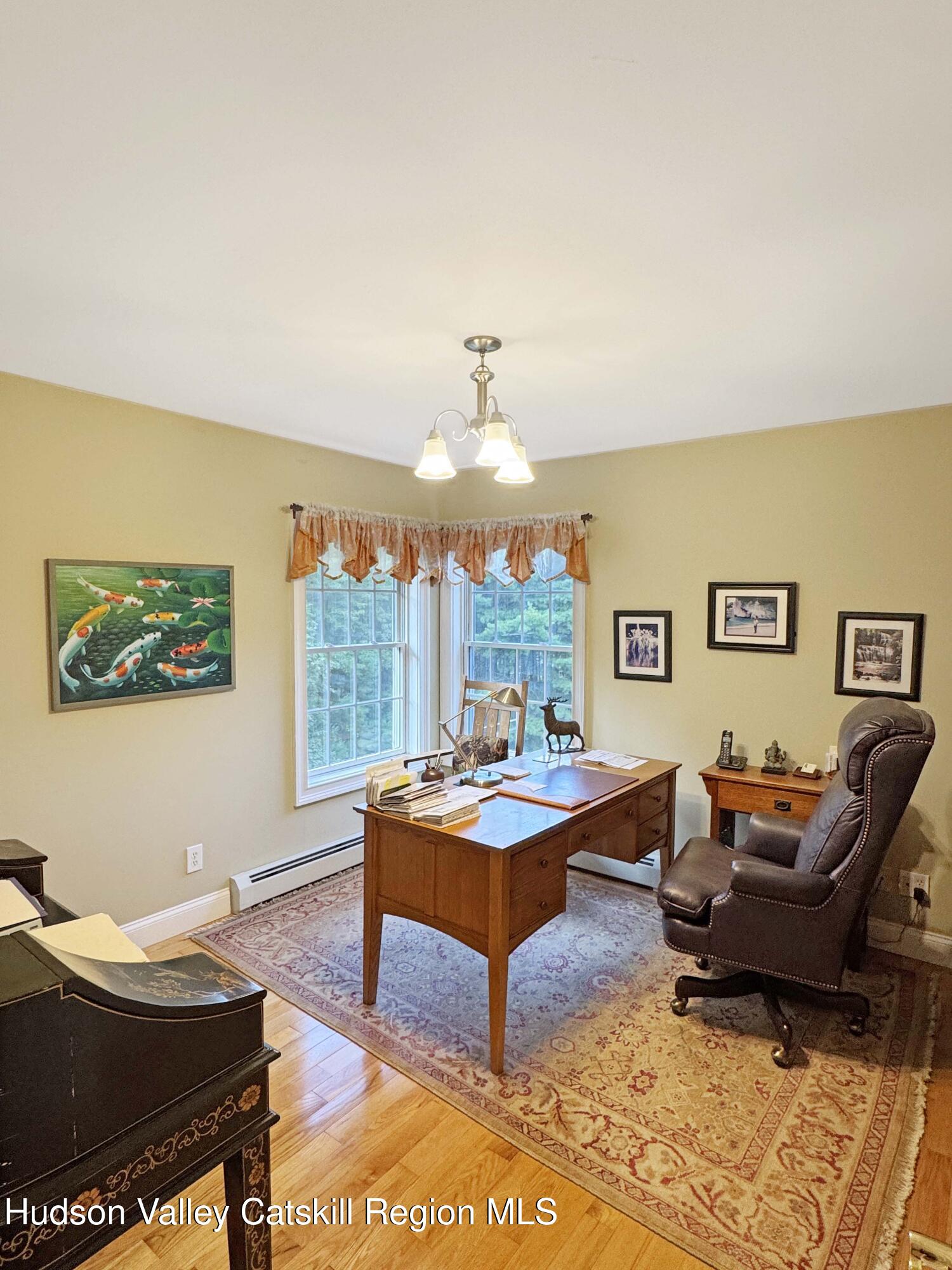 189 Bush Road Stone Ridge, NY 12484 - Photo 26 of 35 a living room with furniture a rug and a window