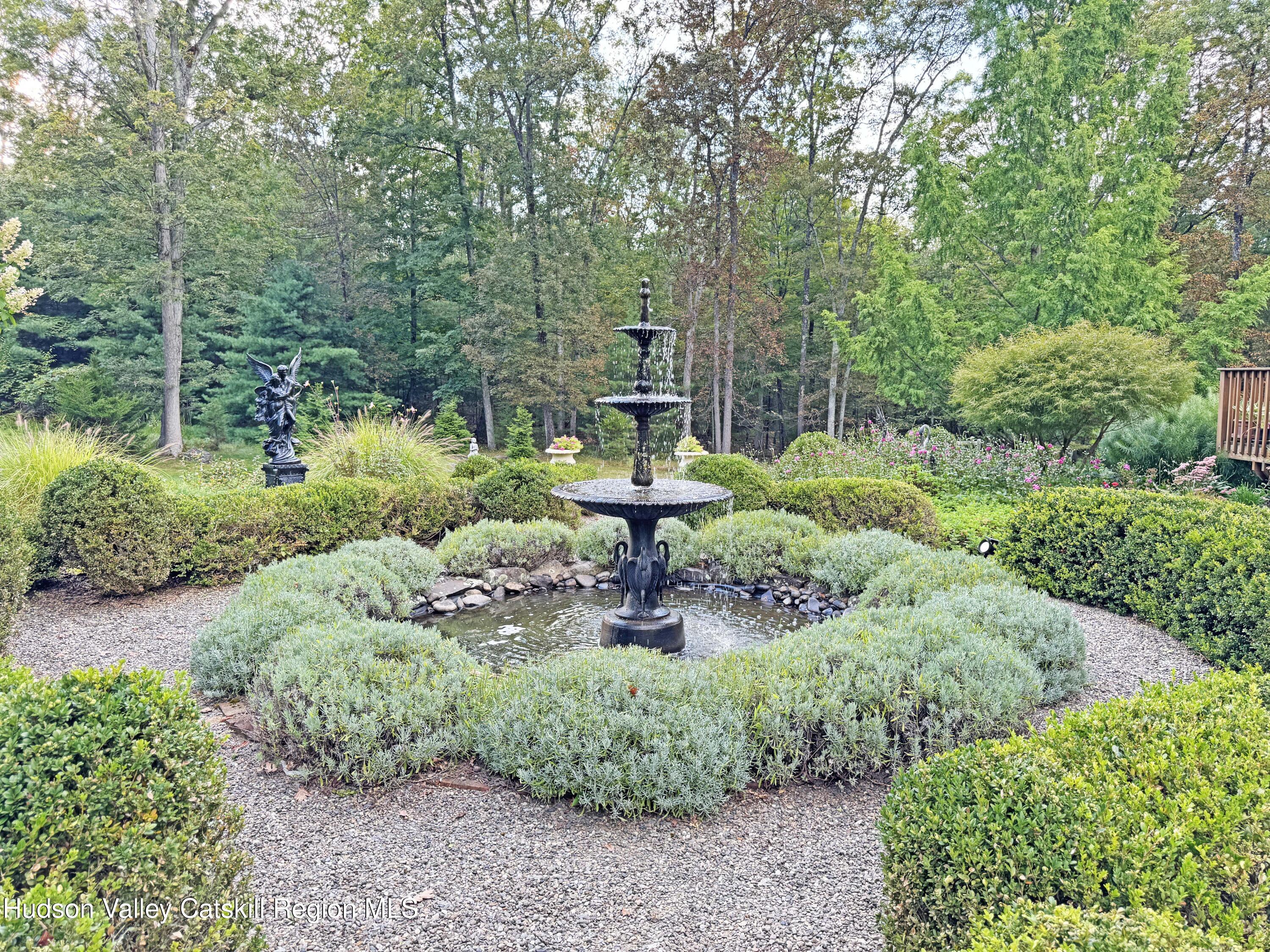 189 Bush Road Stone Ridge, NY 12484 - Photo 32 of 35 a garden view with a fountain