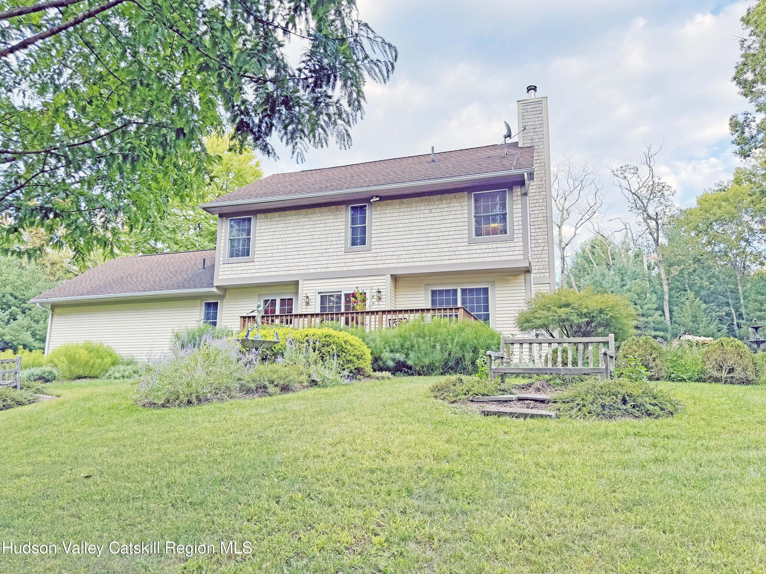 189 Bush Road Stone Ridge, NY 12484 - Photo 34 of 35 a front view of a house with garden