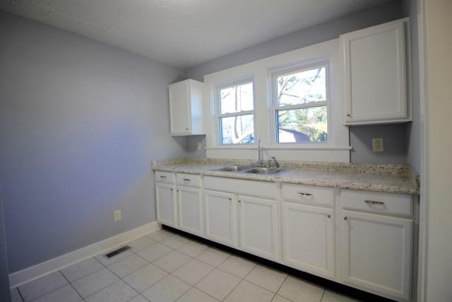 515 West 7th Avenue Springfield, TN 37172 - Photo 5 of 7 The kitchen has new cabinet and countertops with stainless steel sink. It also has a new tile floor!