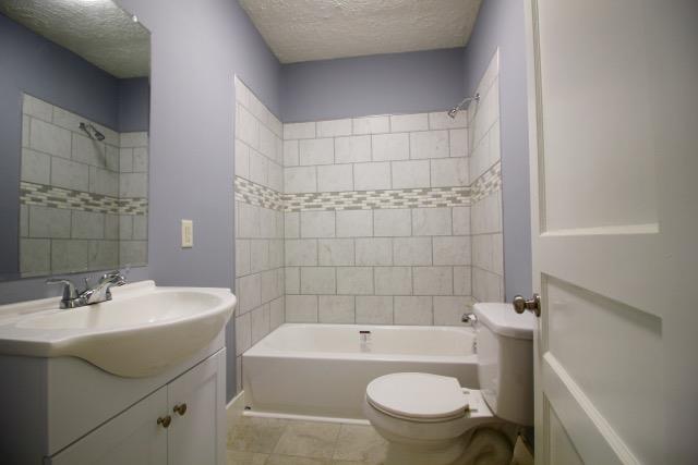 515 West 7th Avenue Springfield, TN 37172 - Photo 6 of 7 The bathroom downstairs is totally renovated. New vanity, tile flooring, and a custom tiled shower makes it gorgeous