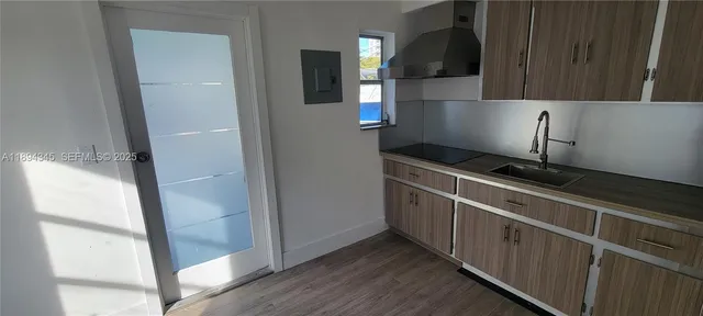 a kitchen with stainless steel appliances a refrigerator and a stove