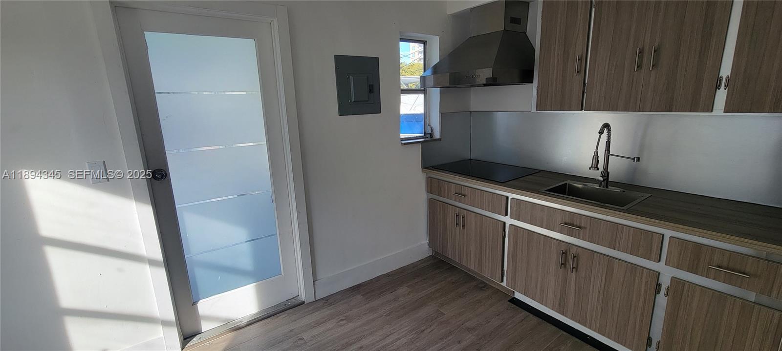 3721 Southwest 27th Terrace Miami, FL 33134 - Photo 11 of 23 a kitchen with stainless steel appliances a refrigerator and a stove
