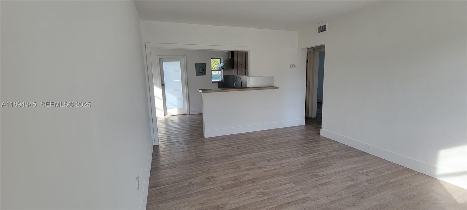 3721 Southwest 27th Terrace Miami, FL 33134 - Photo 7 of 23 a view of a kitchen from a hallway