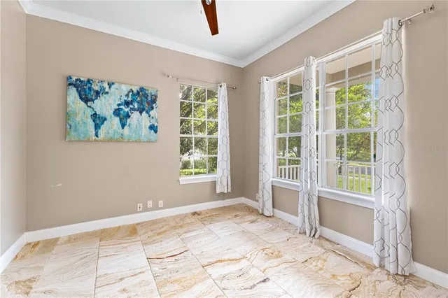 a bathroom with a granite countertop toilet a sink and a mirror