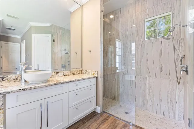 a kitchen with granite countertop a refrigerator and a sink