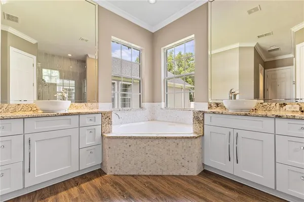 a kitchen with stainless steel appliances granite countertop a stove and a sink
