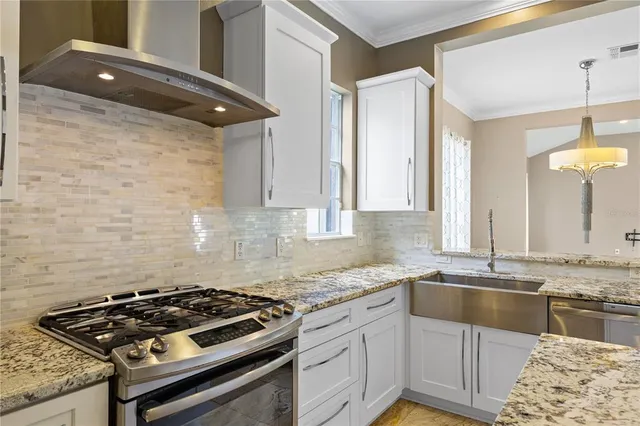 a utility room with sink dryer and washer