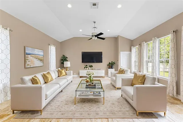 a view of entryway with furniture and wooden floor