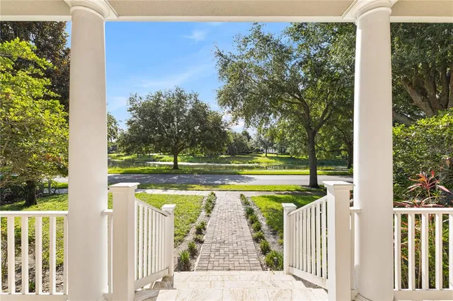 a view of swimming pool with sitting area and garden