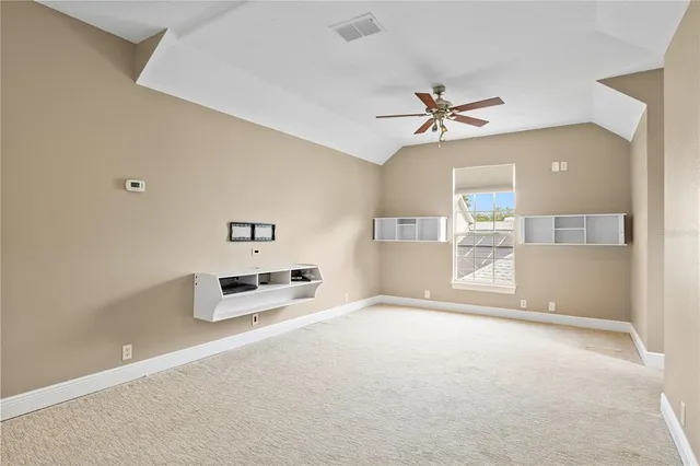 a bathroom with a granite countertop sink a mirror and a shower