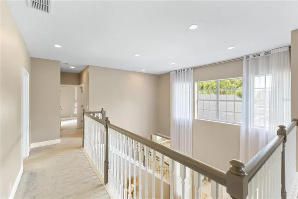 a bathroom with a granite countertop sink mirror vanity and toilet