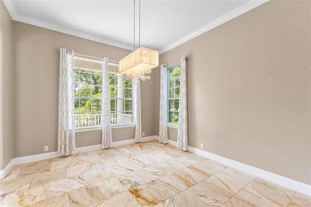 a view of a bedroom with windows