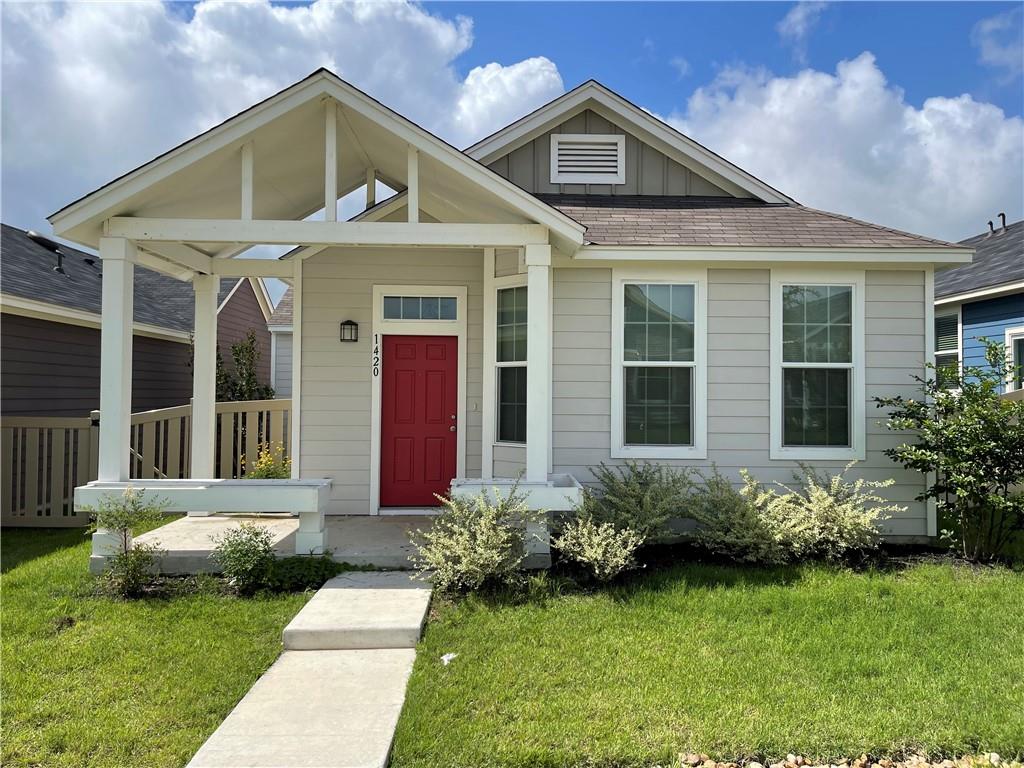 1420 Nevarez Kyle, TX 78640 - Photo 1 of 9 A charming cottage-style home features a prominent covered front porch and neat landscaping.