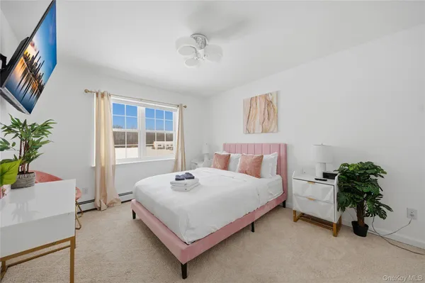 a bedroom with furniture and window