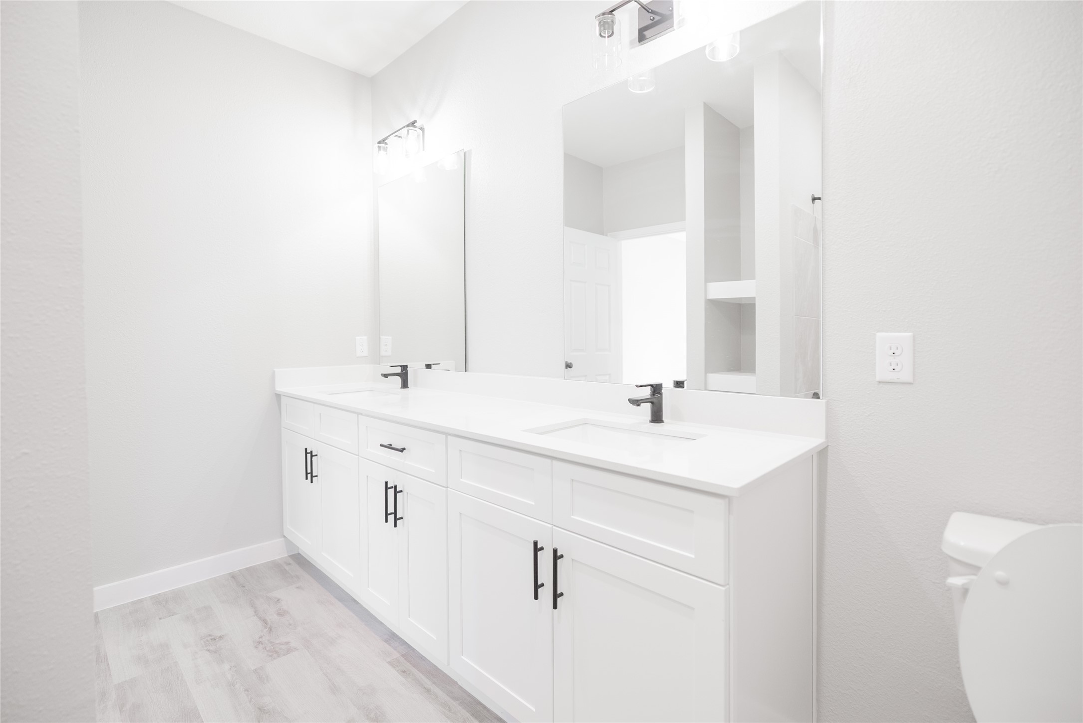 2101 Reinke Road, Unit 3207 Waller, TX 77484 - Photo 20 of 20 a bathroom with a sink a toilet and a mirror
