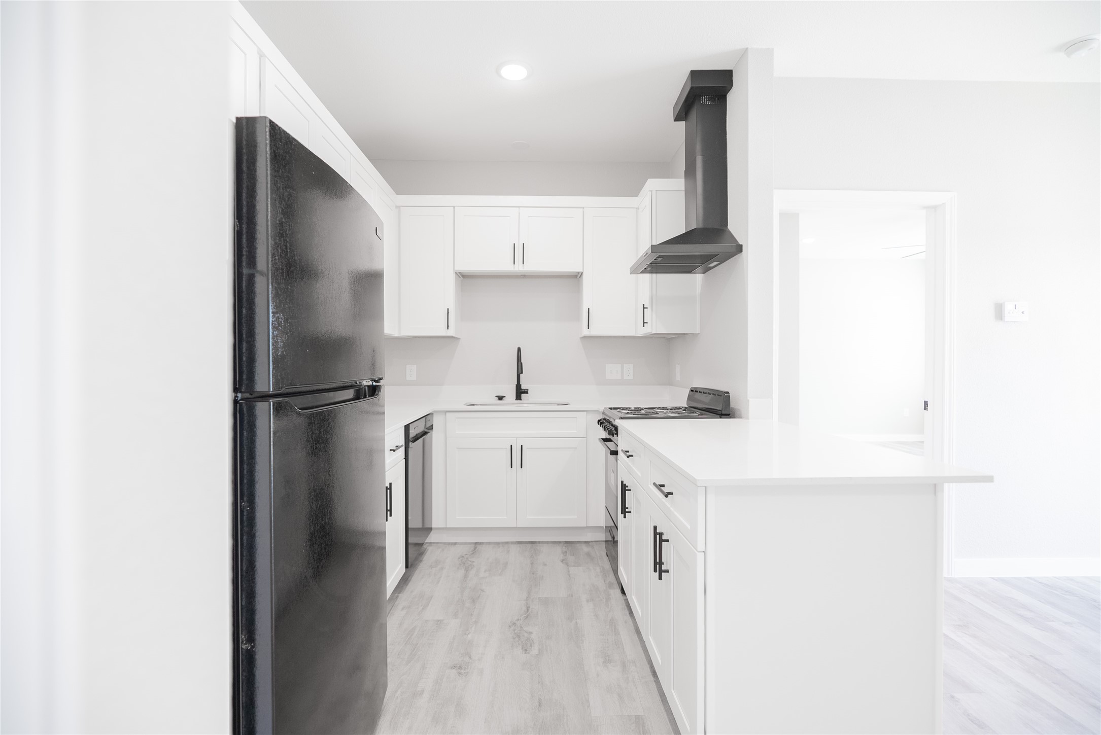 2101 Reinke Road, Unit 3207 Waller, TX 77484 - Photo 2 of 20 a kitchen with a sink a refrigerator and cabinets