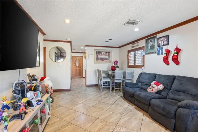 a living room with furniture and flowers