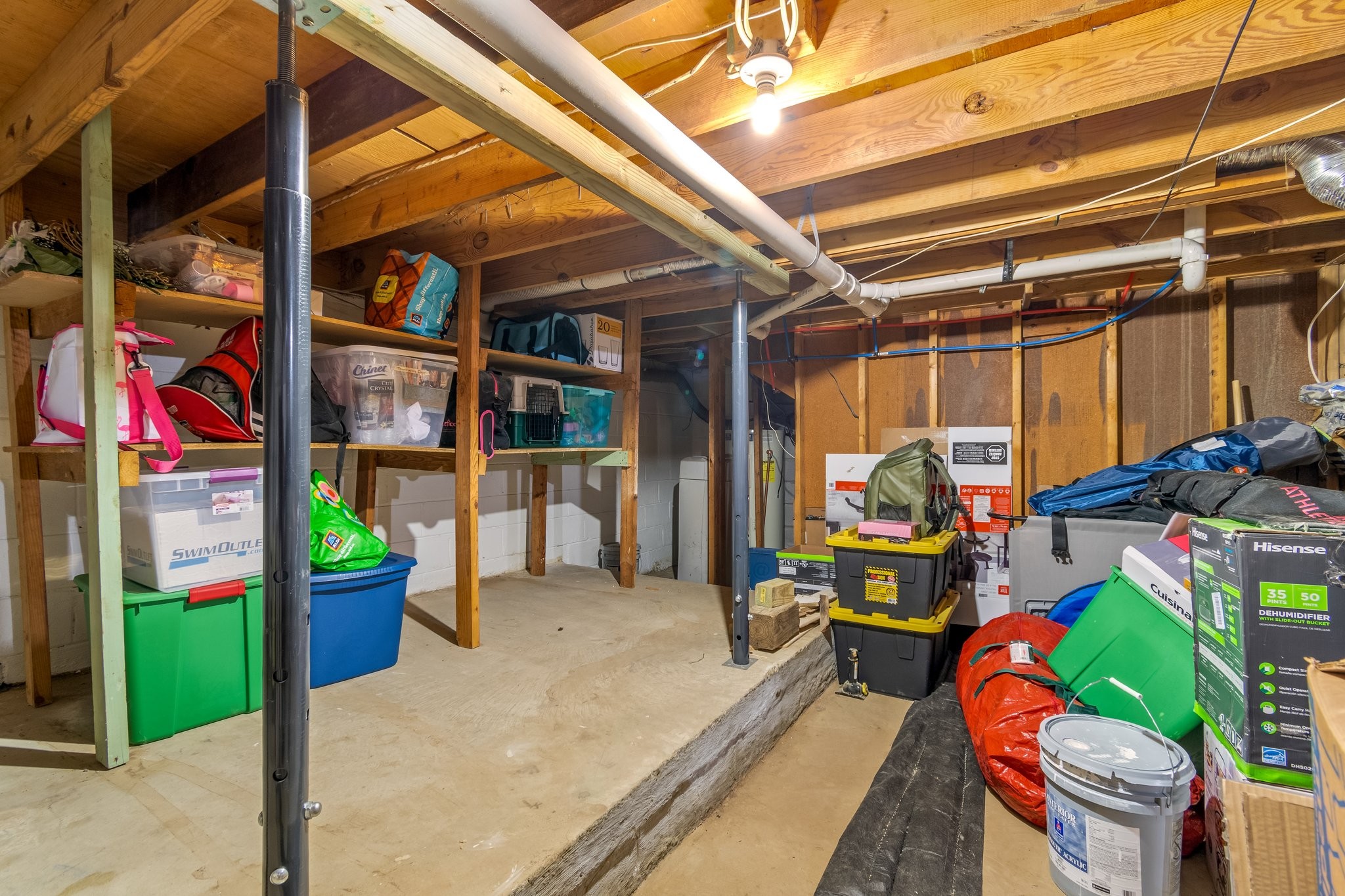 5121 Hilson Road Nashville, TN 37211 - Photo 49 of 63 View from inside the right section of the unfinished area, showing plenty of storage space and the water heater back in the corner, under the stairs