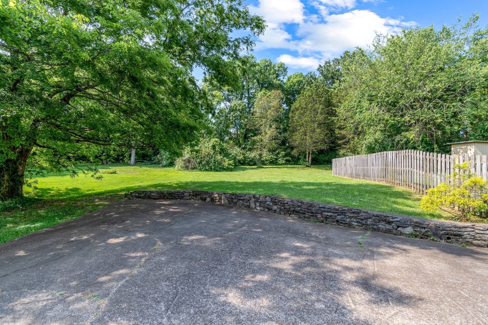 5121 Hilson Road Nashville, TN 37211 - Photo 60 of 63 View from the top of the driveway into the unfenced section of the backyard