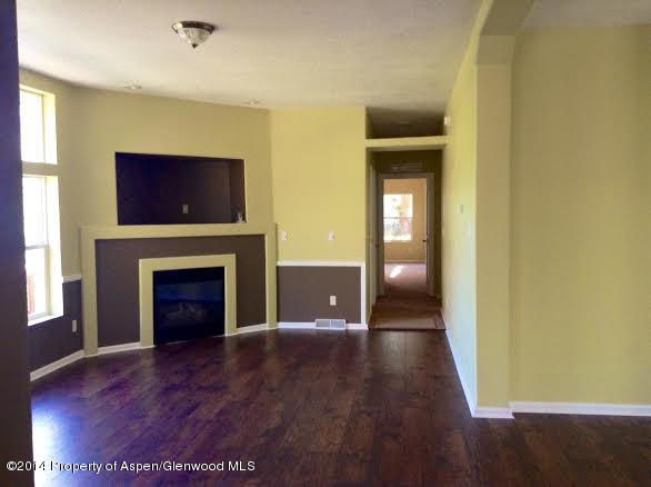 147 East 10th Street Rifle, CO 81650 - Photo 3 of 12 a view of a livingroom with a fireplace