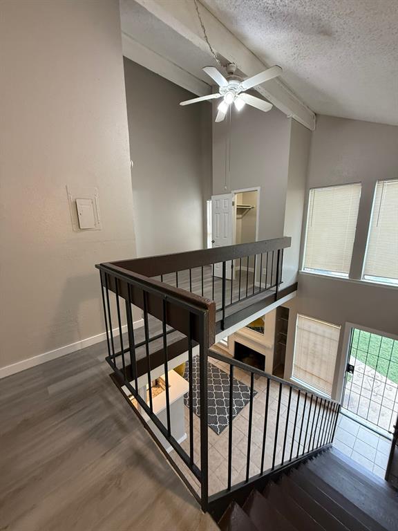 7152 Fair Oaks Avenue, Unit 1181 Dallas, TX 75231 - Photo 6 of 11 a view of staircase with wooden floor and fan