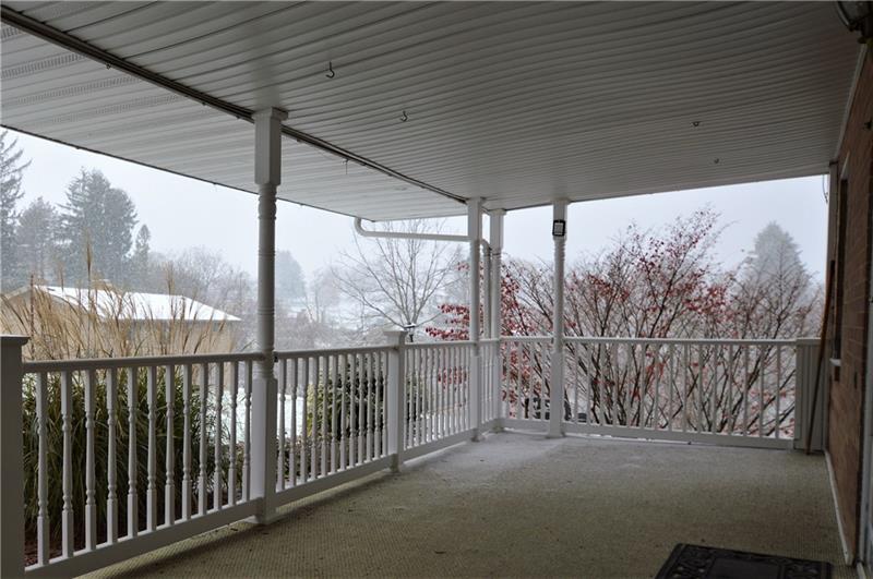 310 Old Jacks Run Road Irwin, PA 15642 - Photo 2 of 21 Front porch, partially wraps around providing cover to the detached garage.