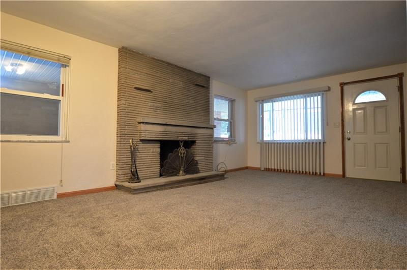 310 Old Jacks Run Road Irwin, PA 15642 - Photo 3 of 21 Enjoy cold evenings in your living room, next to the wood burning fireplace