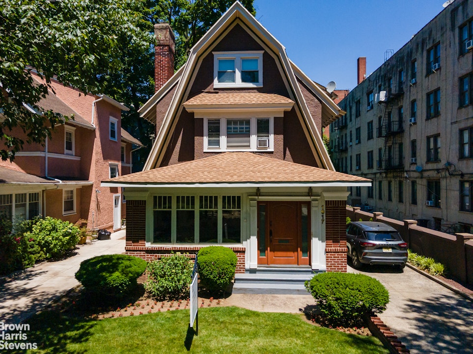 1917 Glenwood Road Brooklyn, NY 11230 - Photo 20 of 22 a front view of a house with a yard