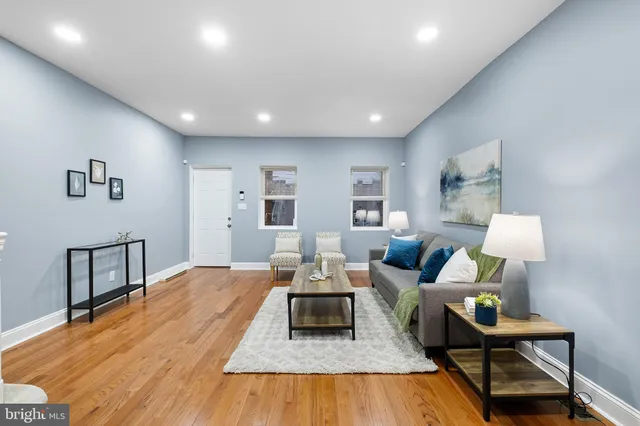 a living room with furniture and a table