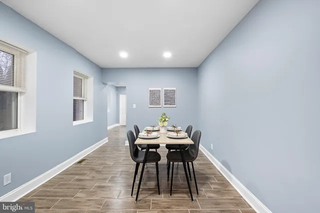 a workspace room with furniture and wooden floor