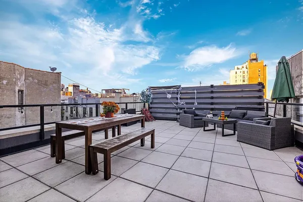a view of a terrace with furniture