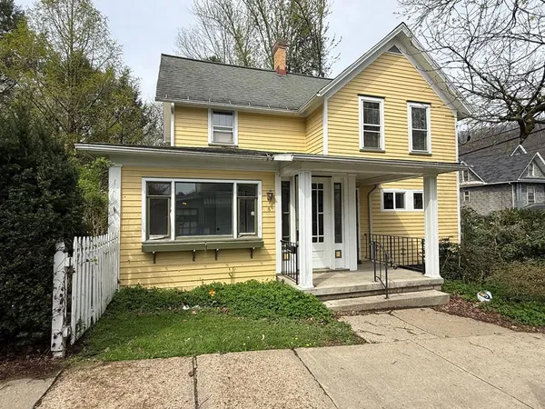 front view of a house with a yard