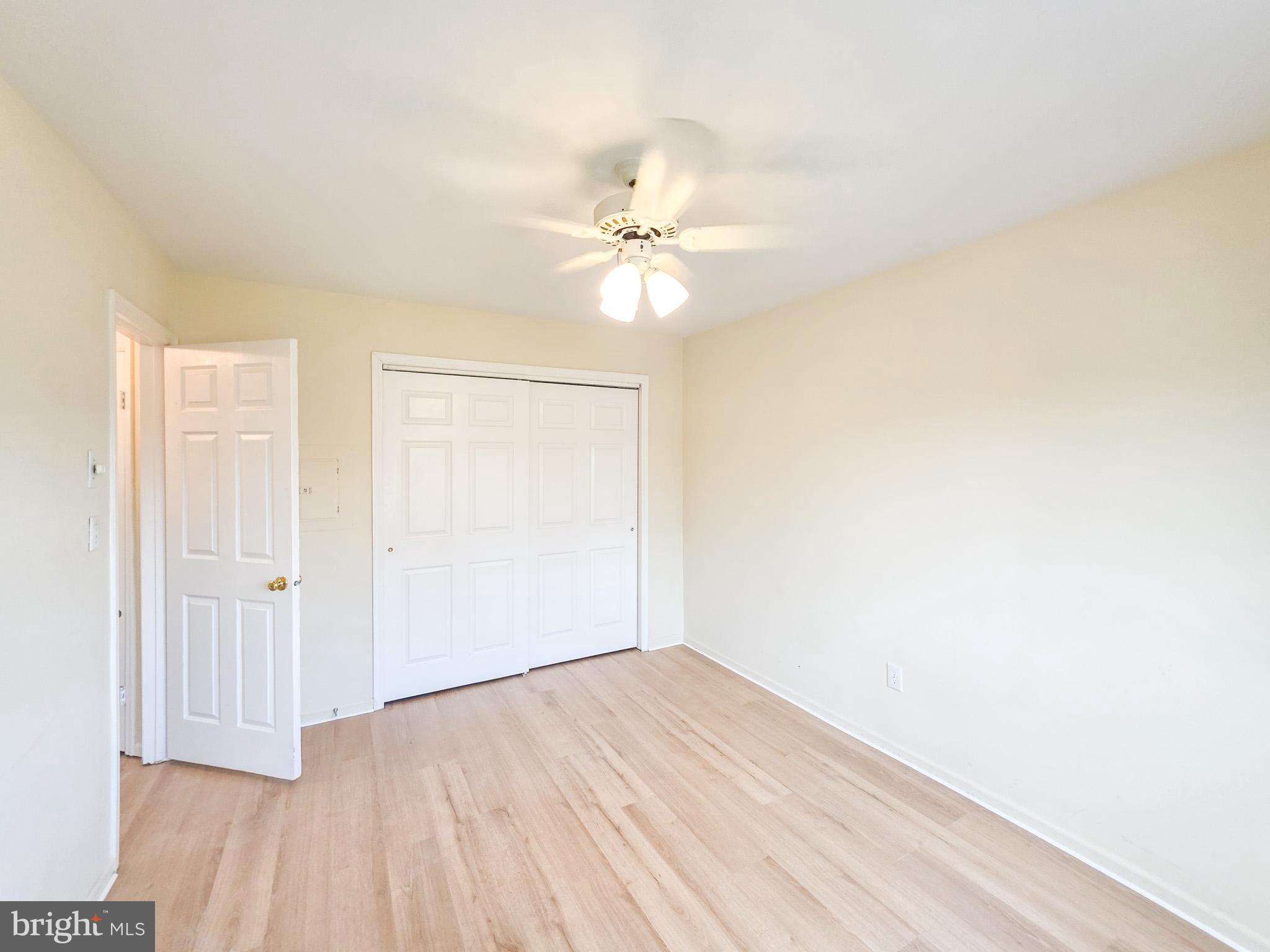 1 Rutland Lane Monroe Township, NJ 08831 - Photo 13 of 26 an empty room with a window and a ceiling fan