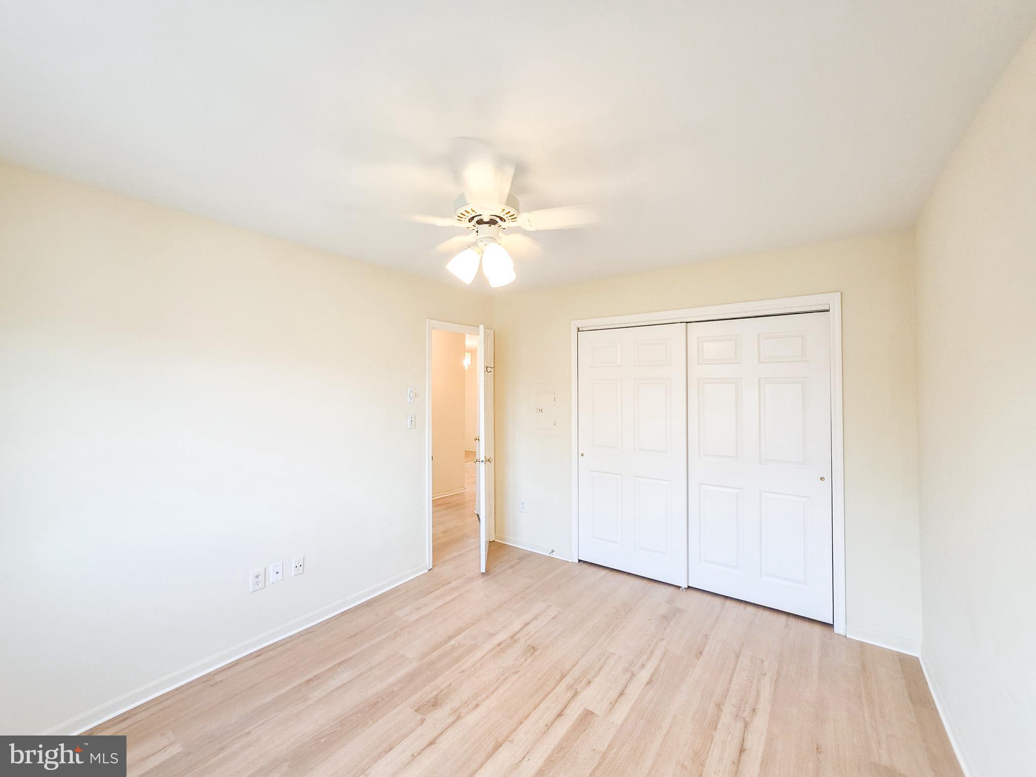 1 Rutland Lane Monroe Township, NJ 08831 - Photo 14 of 26 an empty room with a window and a ceiling fan