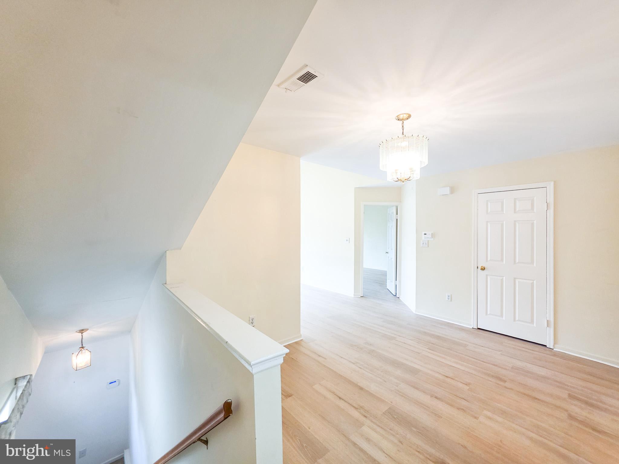 1 Rutland Lane Monroe Township, NJ 08831 - Photo 18 of 26 a view of a hallway with wooden floor