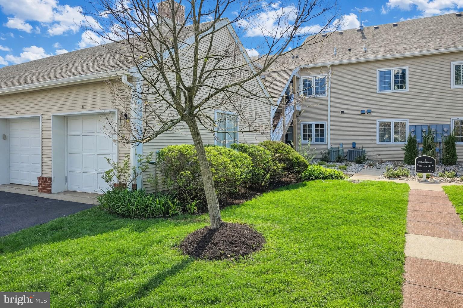 1 Rutland Lane Monroe Township, NJ 08831 - Photo 2 of 26 a front view of house with yard and green space
