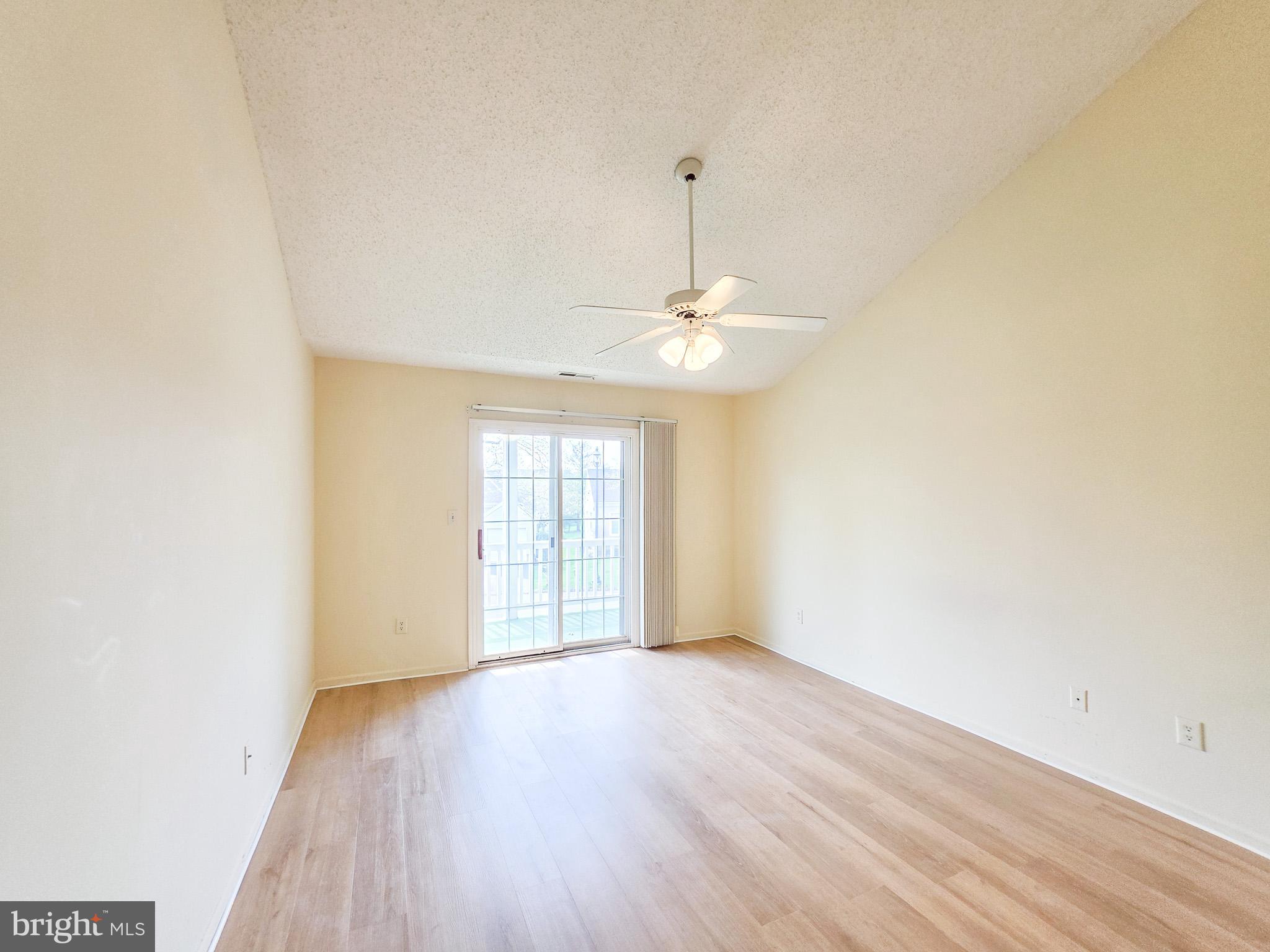 1 Rutland Lane Monroe Township, NJ 08831 - Photo 22 of 26 an empty room with wooden floor chandelier and windows