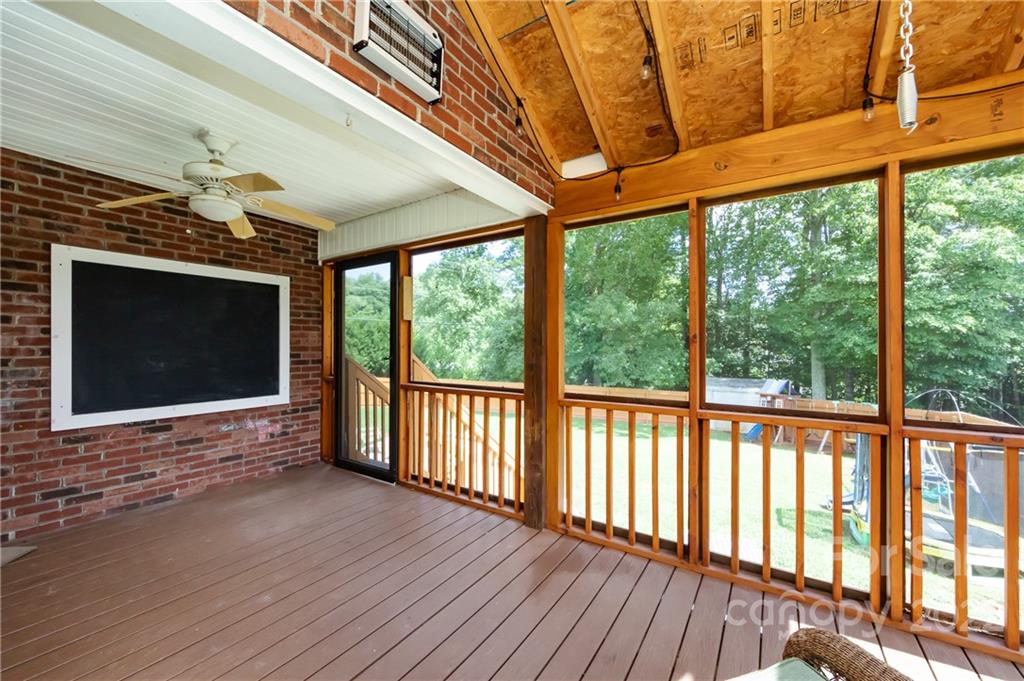 7760 Wallace Lane Denver, NC 28037 - Photo 21 of 48 a view of an empty room with wooden floor and a window