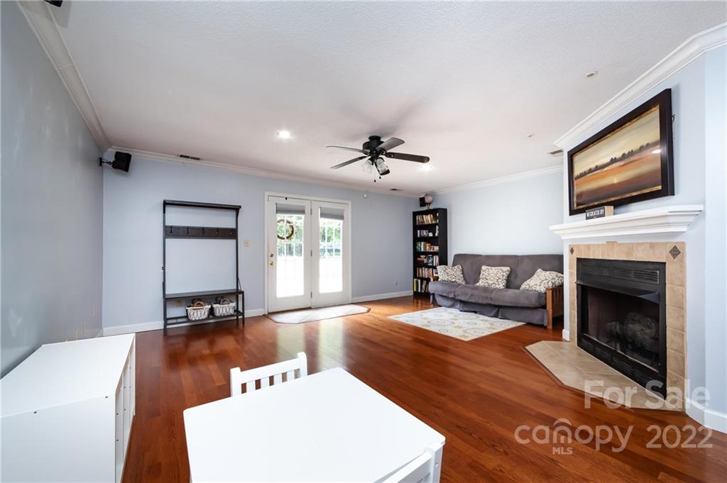 7760 Wallace Lane Denver, NC 28037 - Photo 24 of 48 a living room with furniture and a flat screen tv