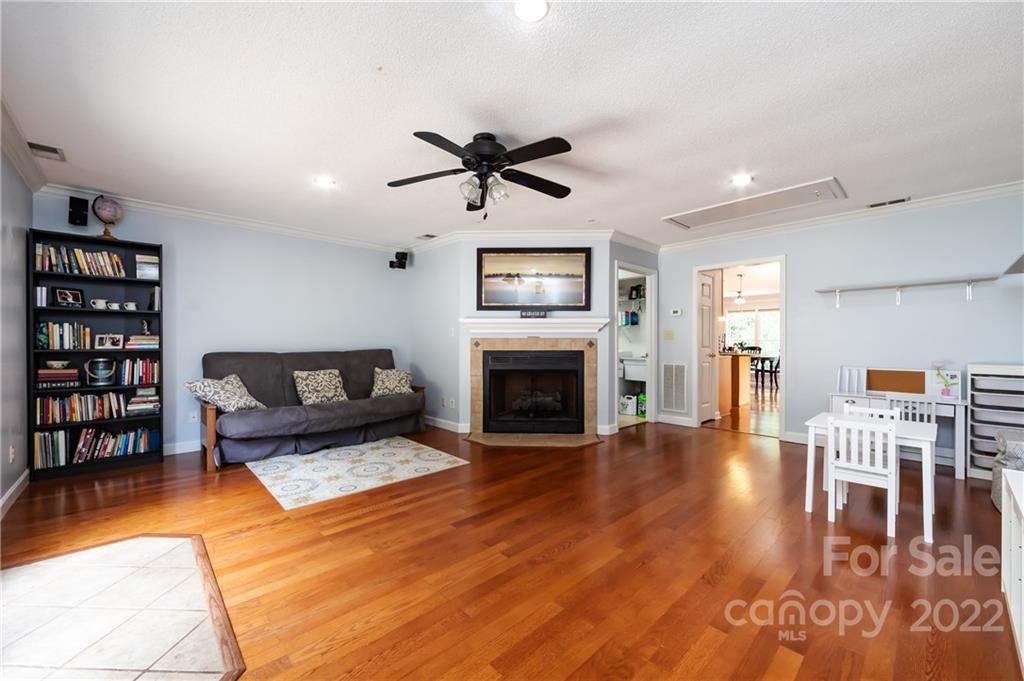 7760 Wallace Lane Denver, NC 28037 - Photo 25 of 48 a living room with furniture and a fireplace