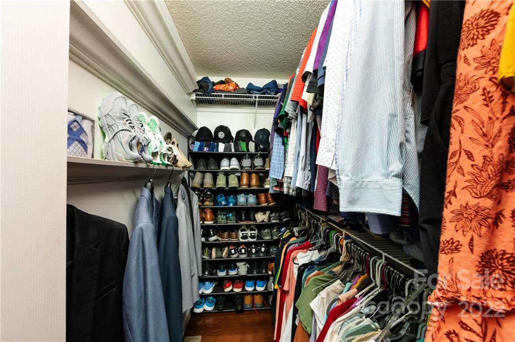 7760 Wallace Lane Denver, NC 28037 - Photo 31 of 48 a view of walk in closet with clothes and shoes