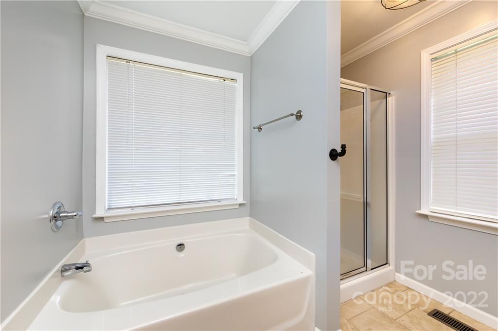 7760 Wallace Lane Denver, NC 28037 - Photo 33 of 48 a white bath tub sitting next to a window